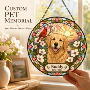 Custom pet memorial cardinal suncatcher held near a sunlit window